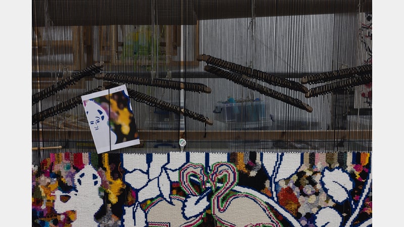 Detail showing work-in-progress for Cosmological World tapestry by Chila Burman in collaboration with West Dean Tapestry Studio for Chila Welcomes You at IWM North © IWM